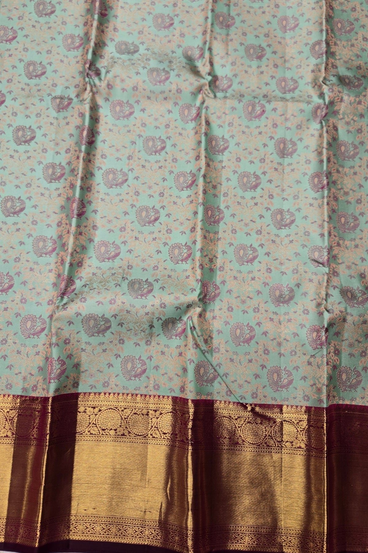 Traditional saree with floral pattern and brown border