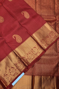 Red and gold traditional fabric with paisley patterns