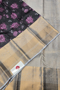 Two scarves, one with floral pattern and one with geometric design, on a textured surface.
