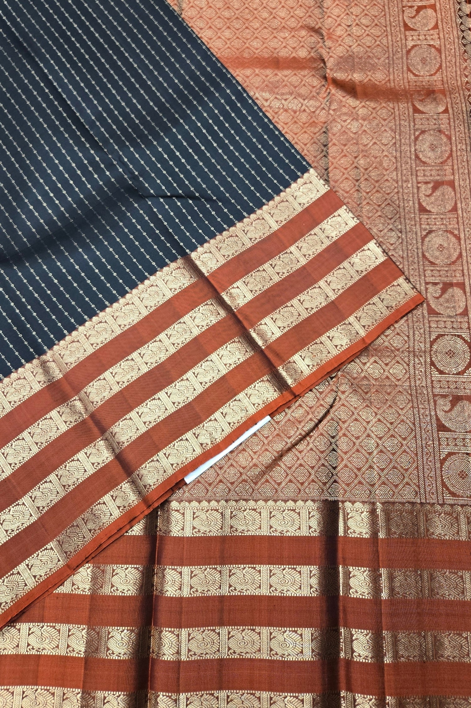 Close-up of a traditional fabric with intricate patterns and colors.