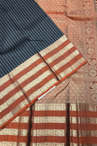 Close-up of a traditional fabric with intricate patterns and colors.