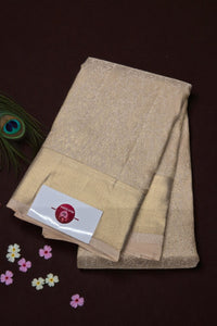 Beige towel with a brand label on a dark brown background
