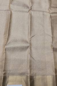 Close-up of beige fabric with a subtle pattern