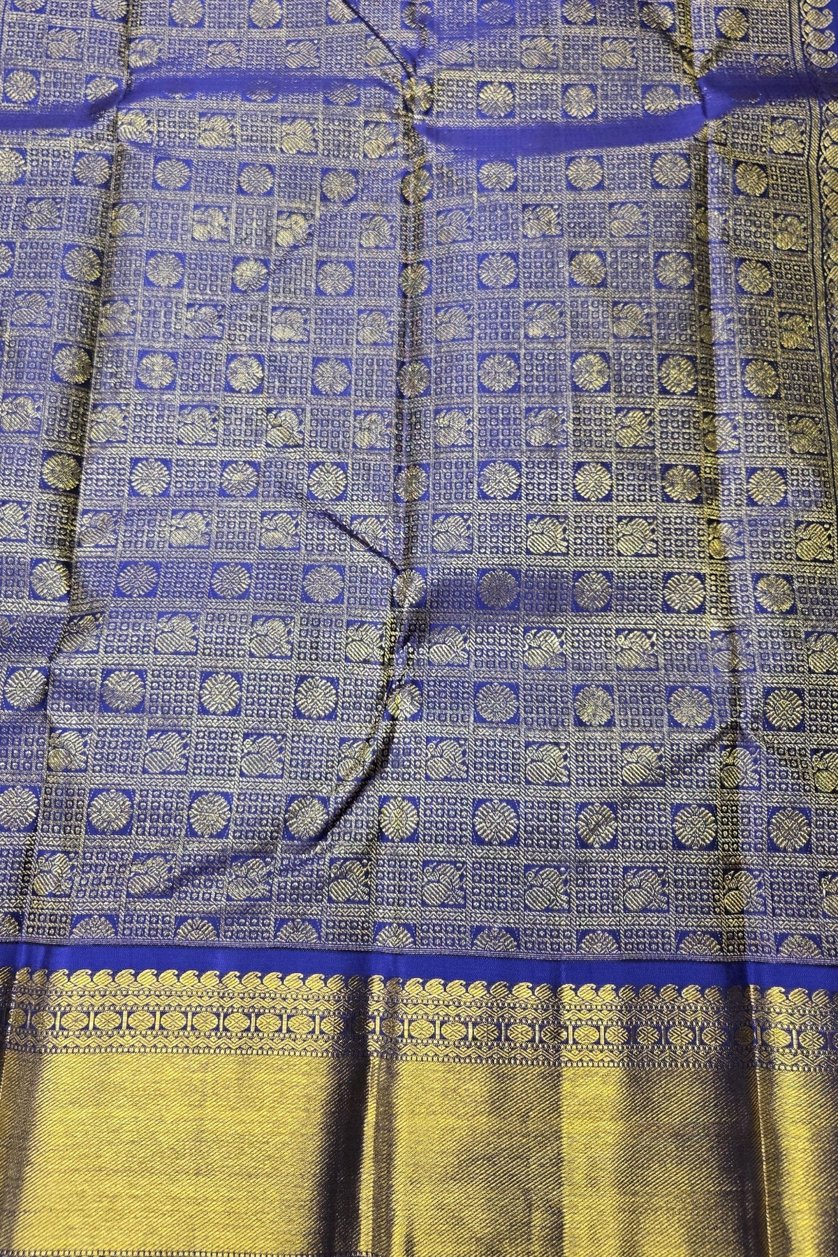 Blue and yellow fabric with intricate patterns