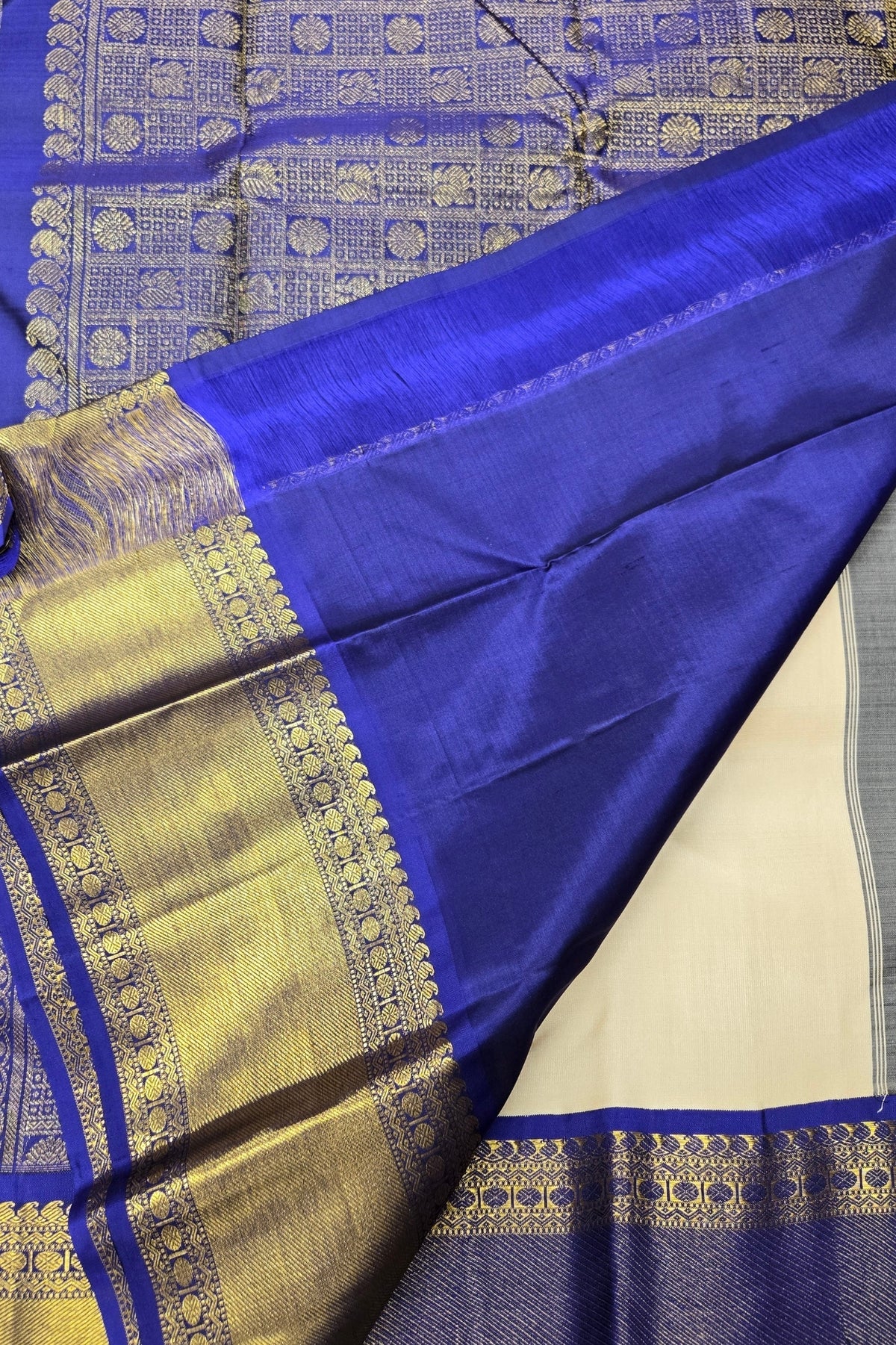 Blue and gold traditional fabric with intricate patterns