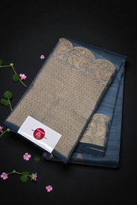 Textile with intricate patterns on a dark background