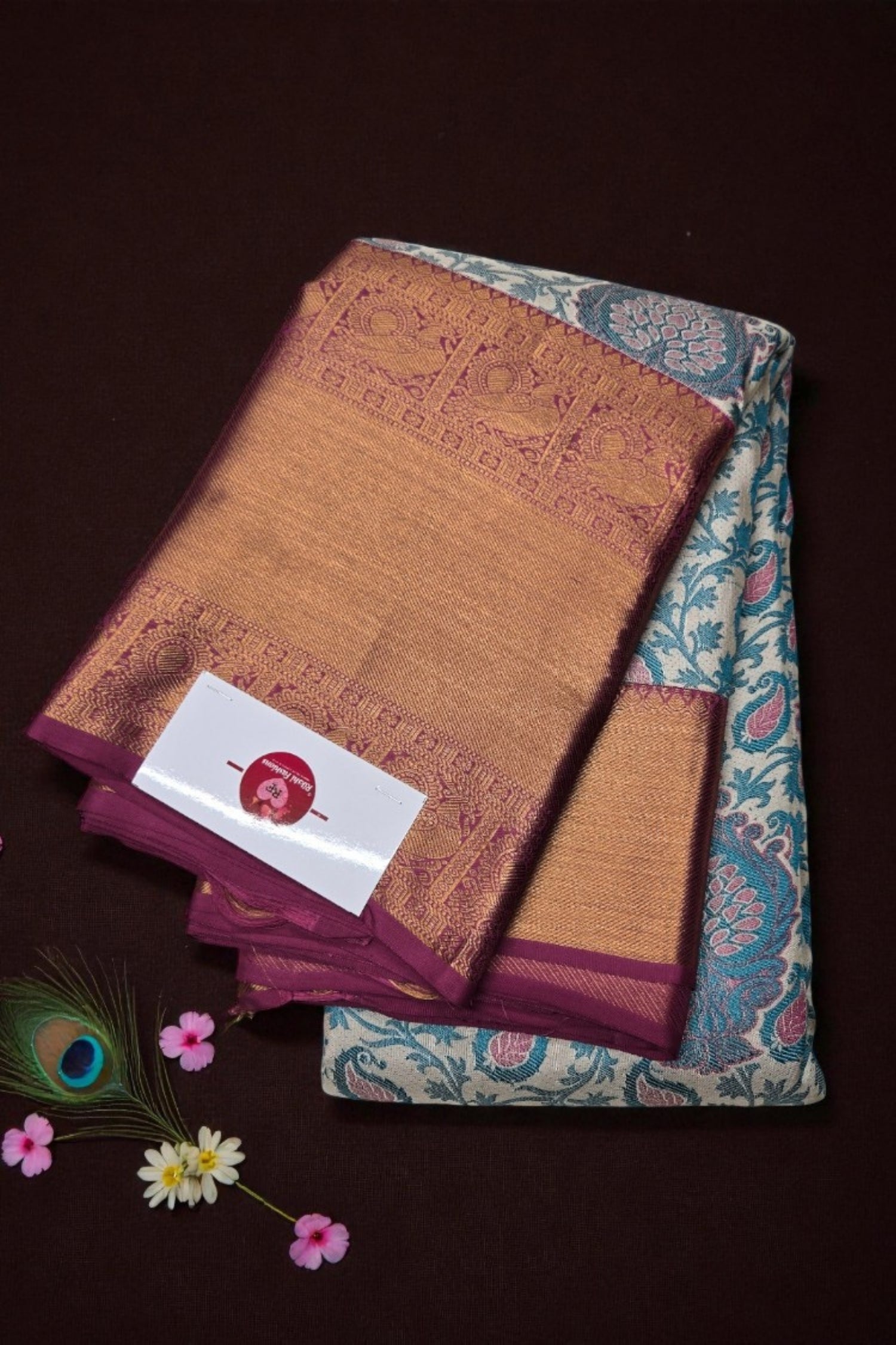 Two patterned cloths with a brand tag on a dark background