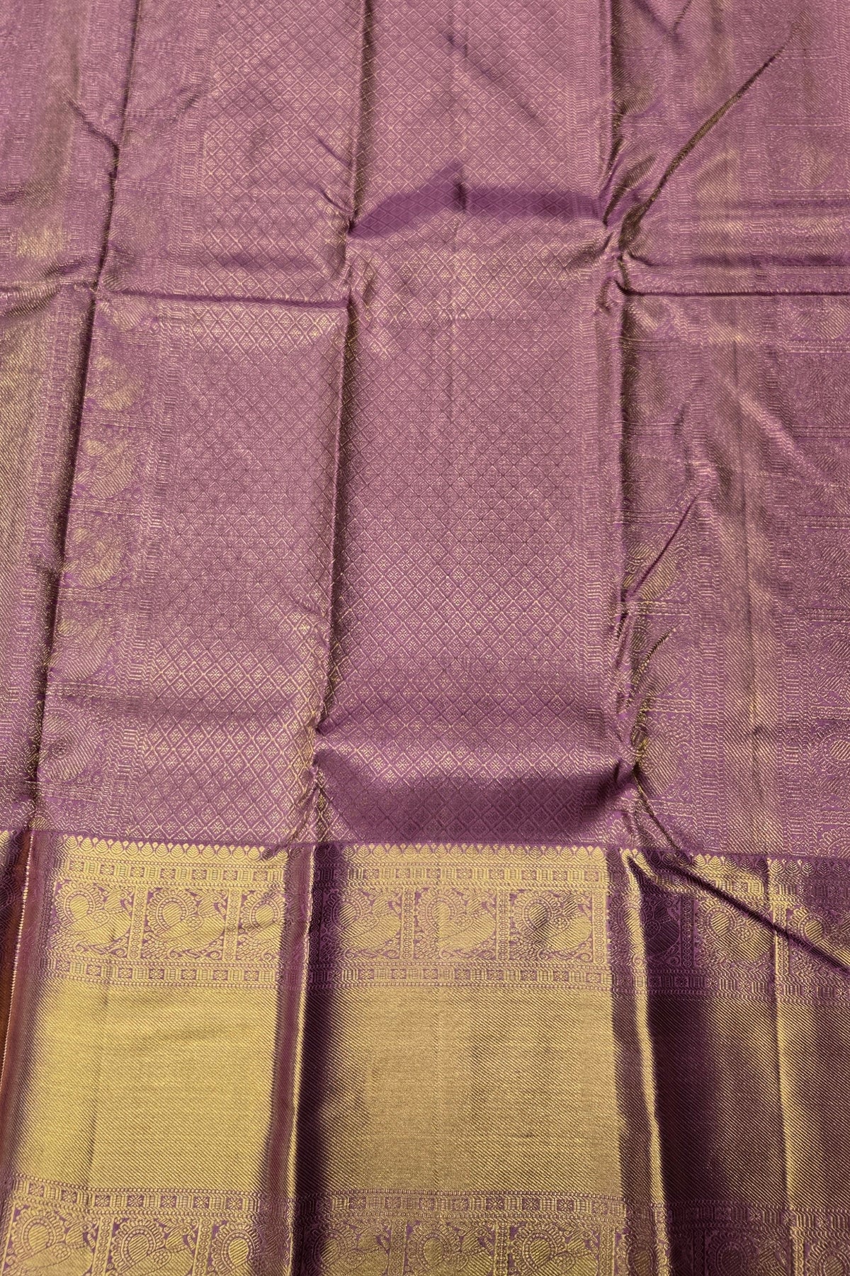 Purple and green fabric with intricate patterns