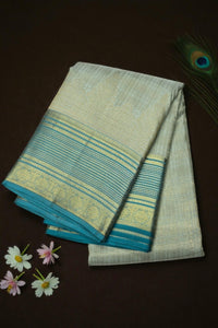 Folded fabric with blue and green stripes on a dark background