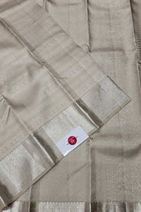 Beige fabric with a brand label on a beige background