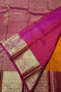 Saree with pink and gold patterns on a textured fabric background