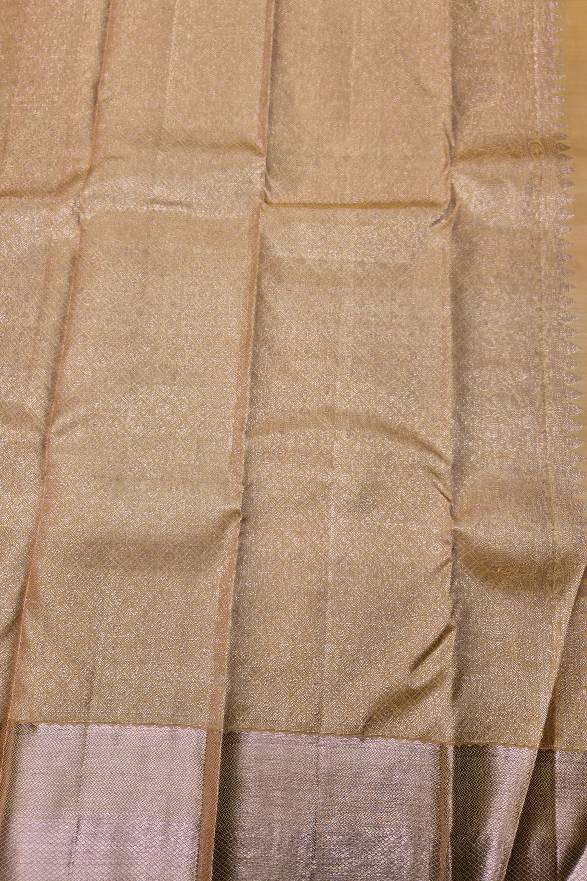 Close-up of beige fabric with a subtle pattern