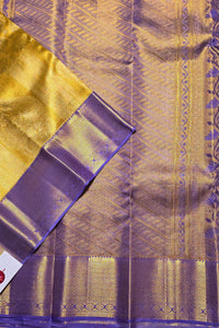 Close-up of a yellow and purple fabric with intricate patterns