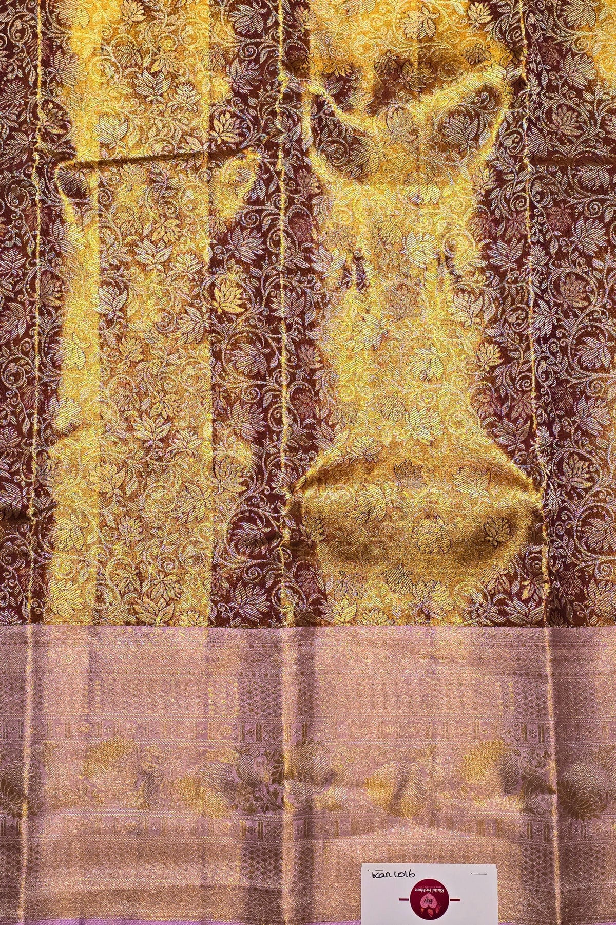 Textured fabric with gold and brown patterns