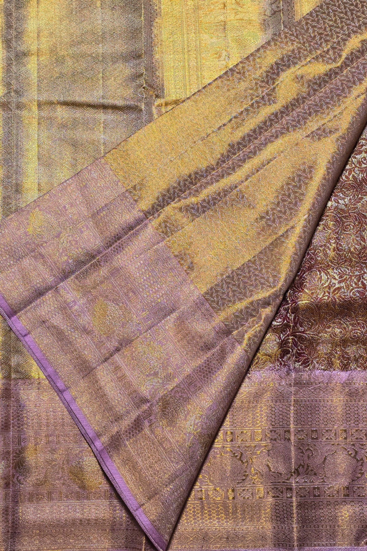 Textured fabric with gold and brown patterns