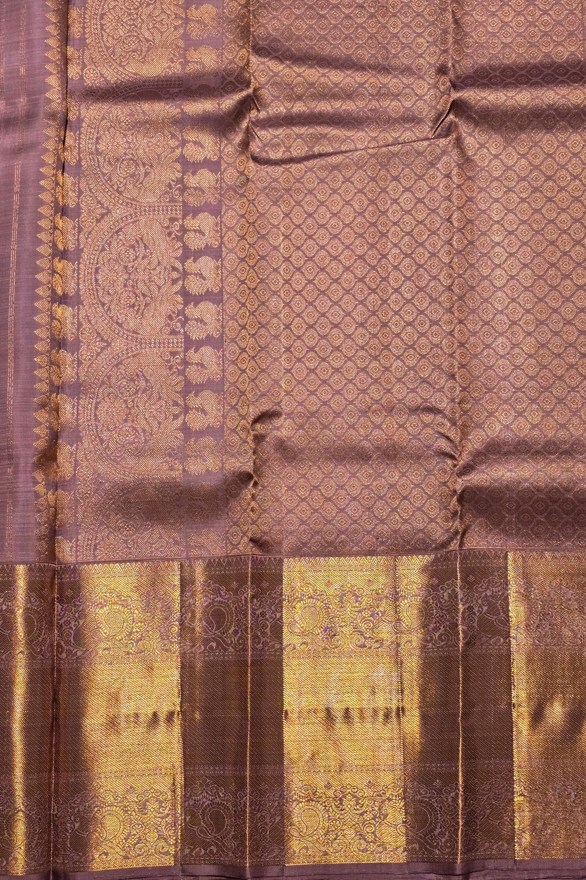 Silk saree with intricate patterns and a border
