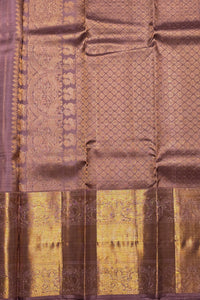 Silk saree with intricate patterns and a border