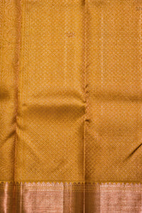 Close-up of a mustard yellow fabric with a subtle pattern