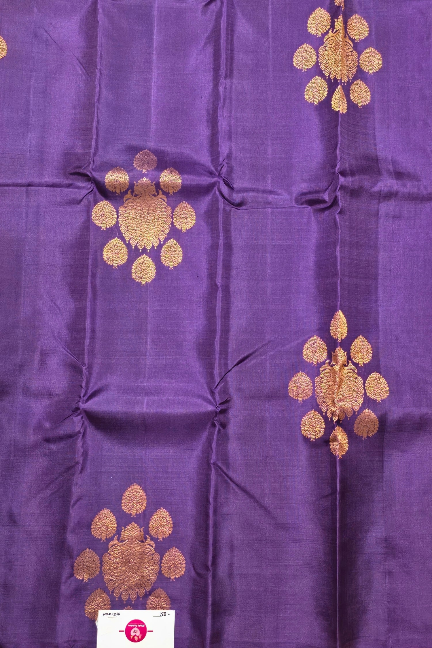 Purple fabric with gold embroidery patterns