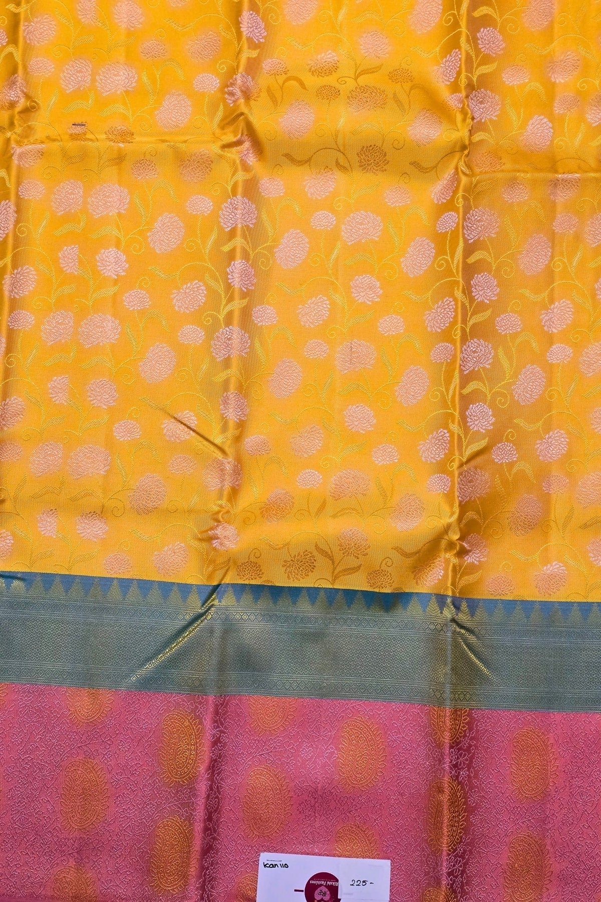 Yellow and pink fabric with floral patterns