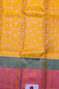 Yellow and pink fabric with floral patterns
