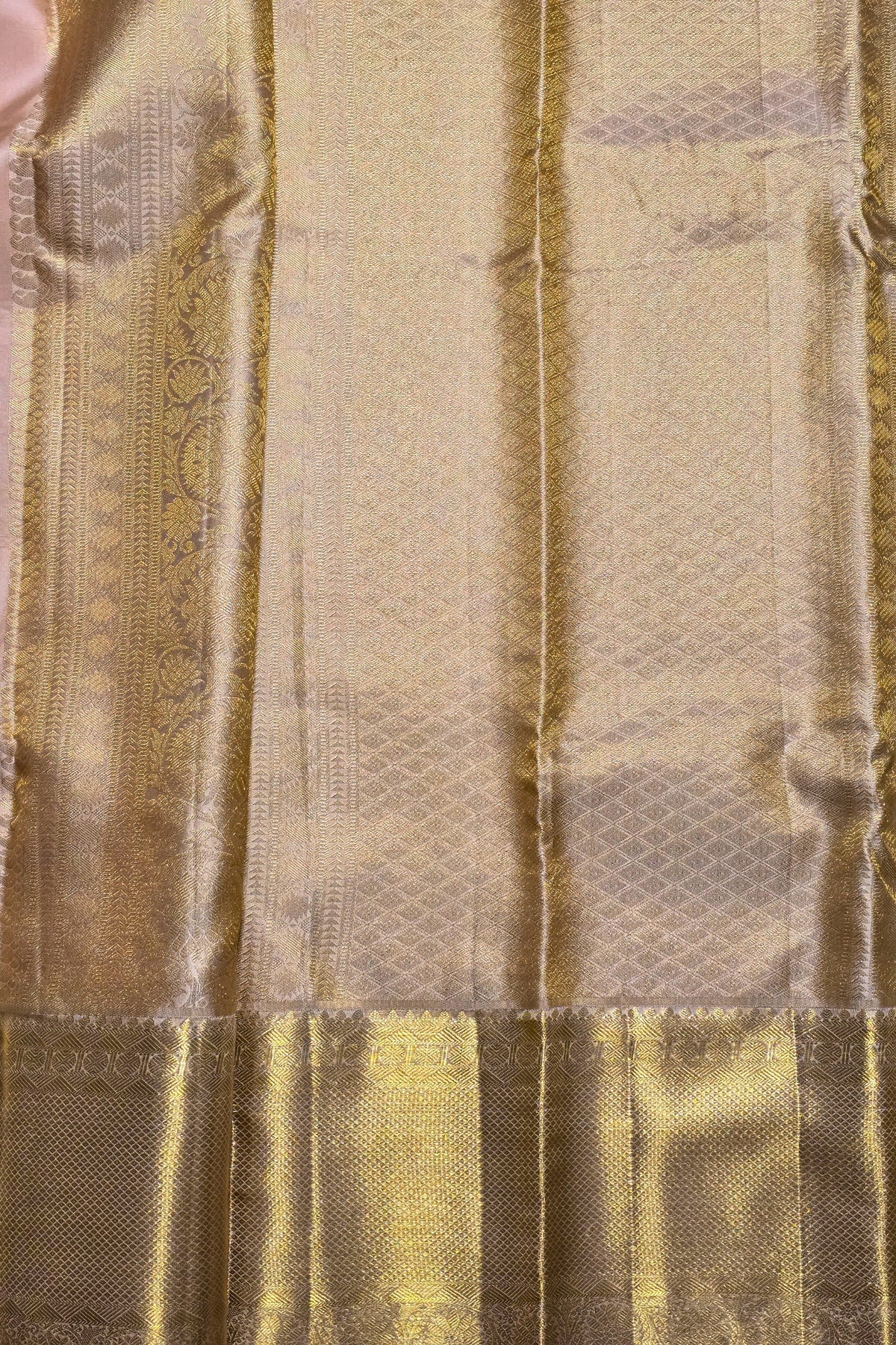Close-up of a textured fabric with gold and beige colors