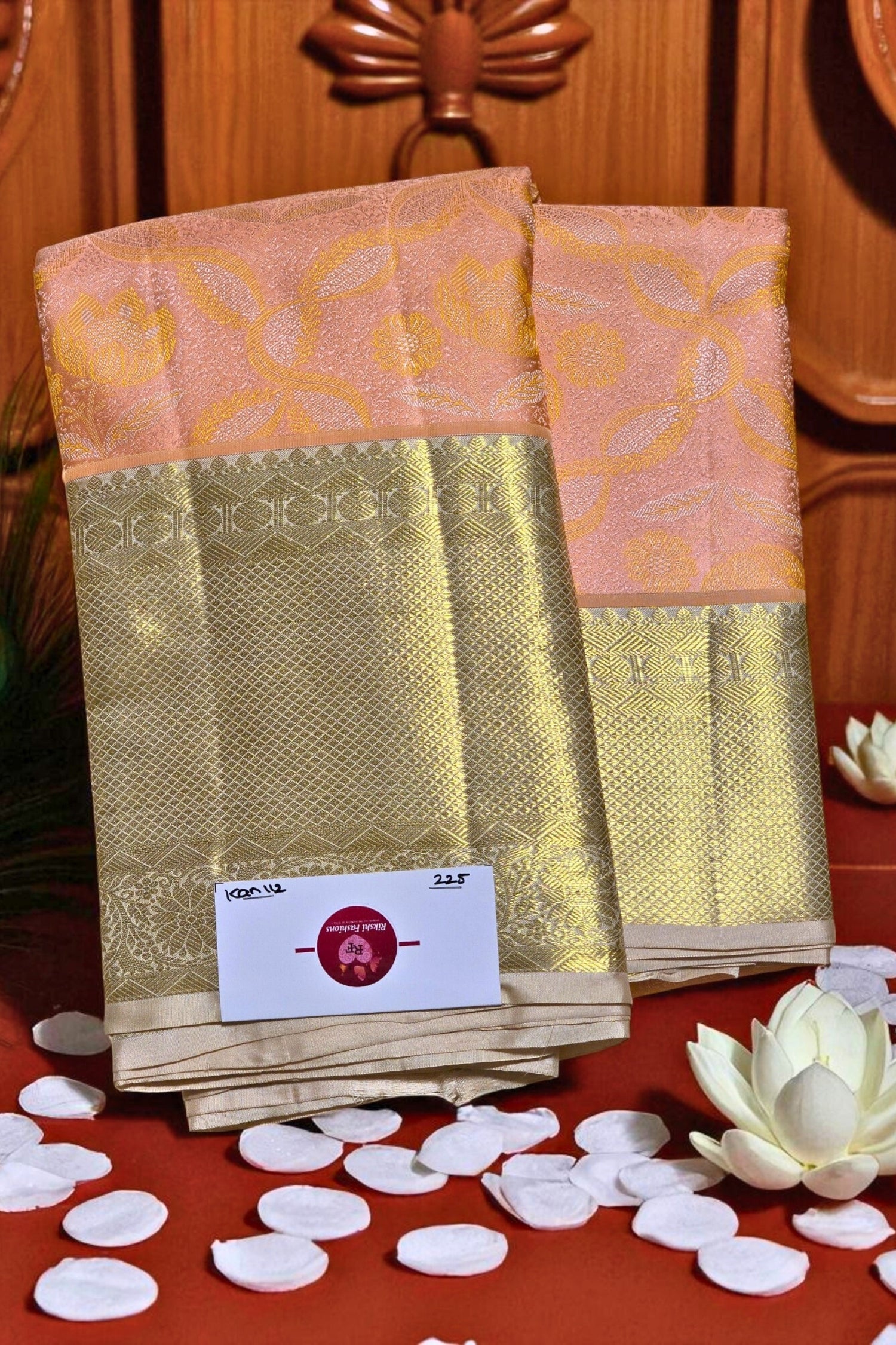 Traditional saree with a gold border on a red background