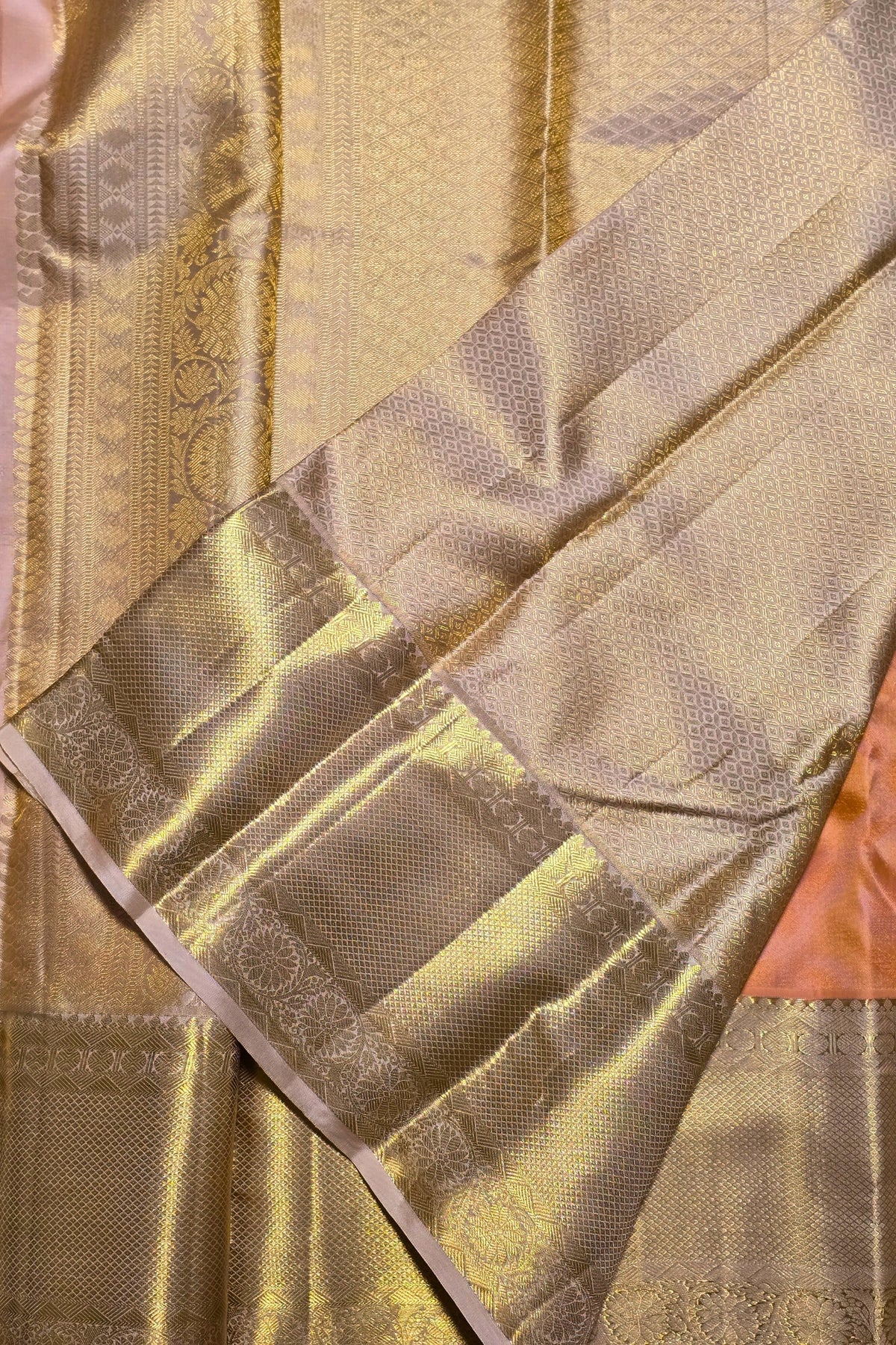 Close-up of a gold fabric with intricate patterns