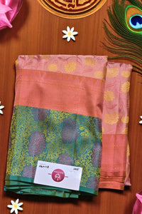 sarees with a brand label on a wooden surface with decorative elements.