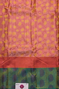 Fabric with pink background and yellow floral pattern, green border