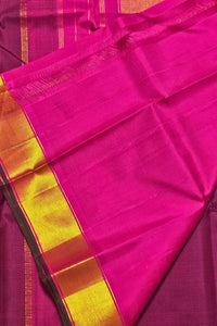 Pink saree with a yellow border