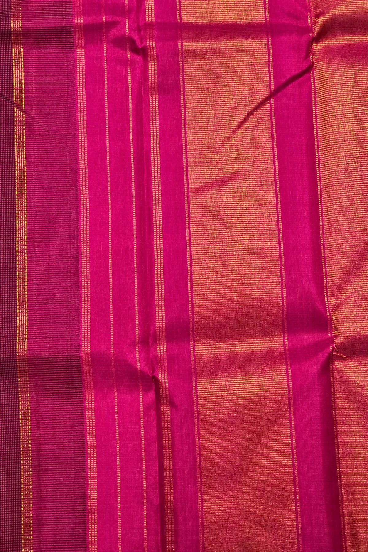 Close-up of pink and gold striped fabric