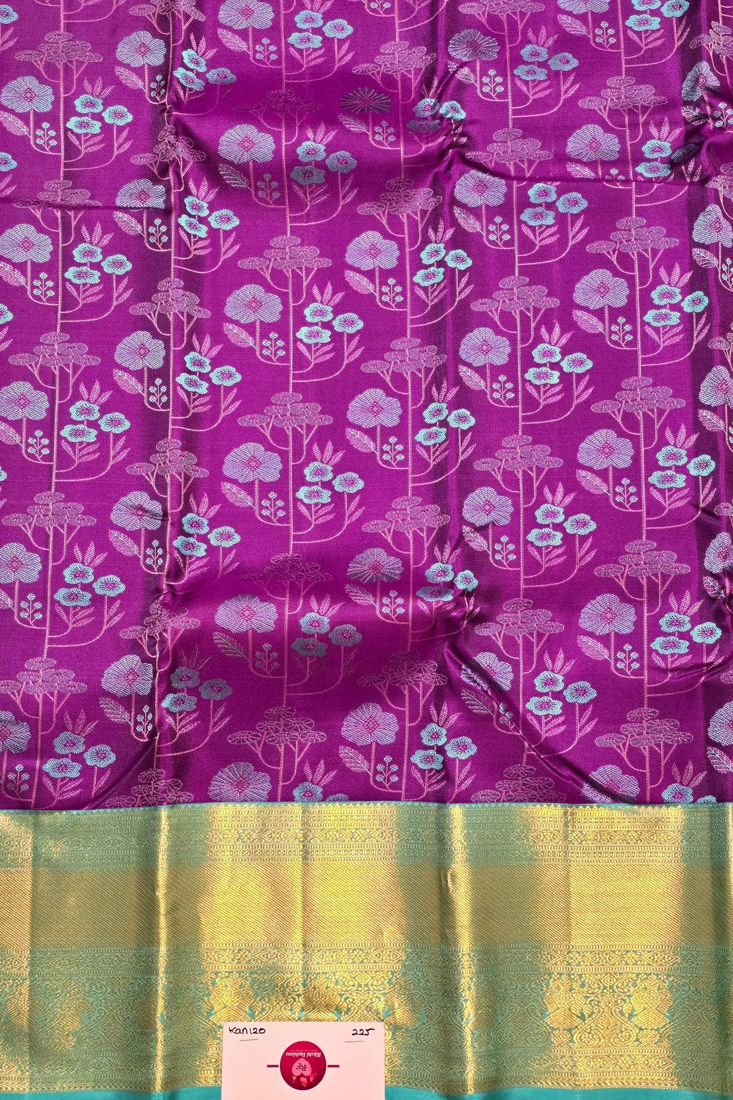 Purple saree with floral pattern and yellow border