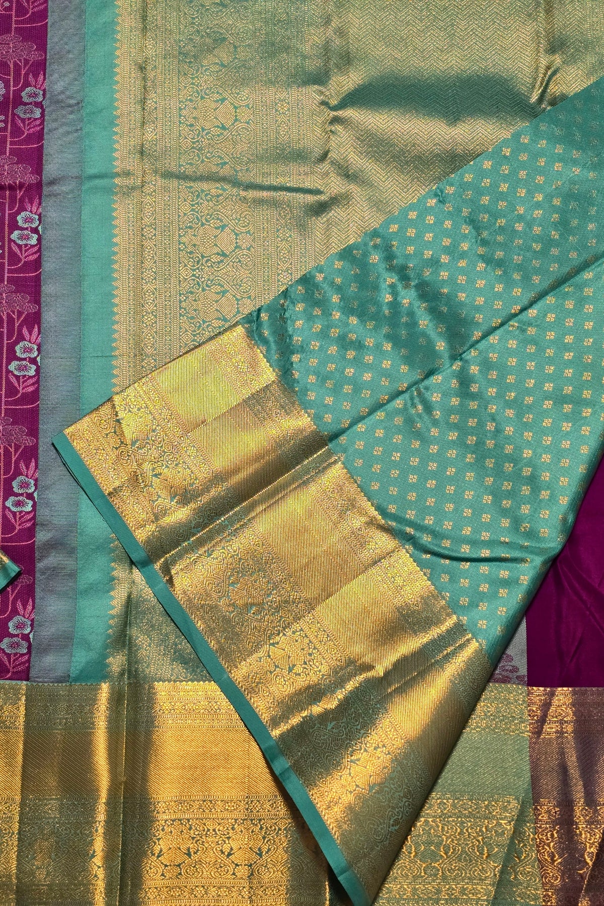 Traditional saree with green, gold, and pink colors