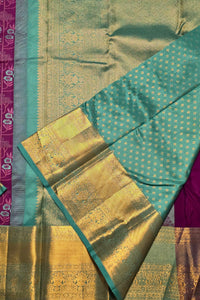 Traditional saree with green, gold, and pink colors