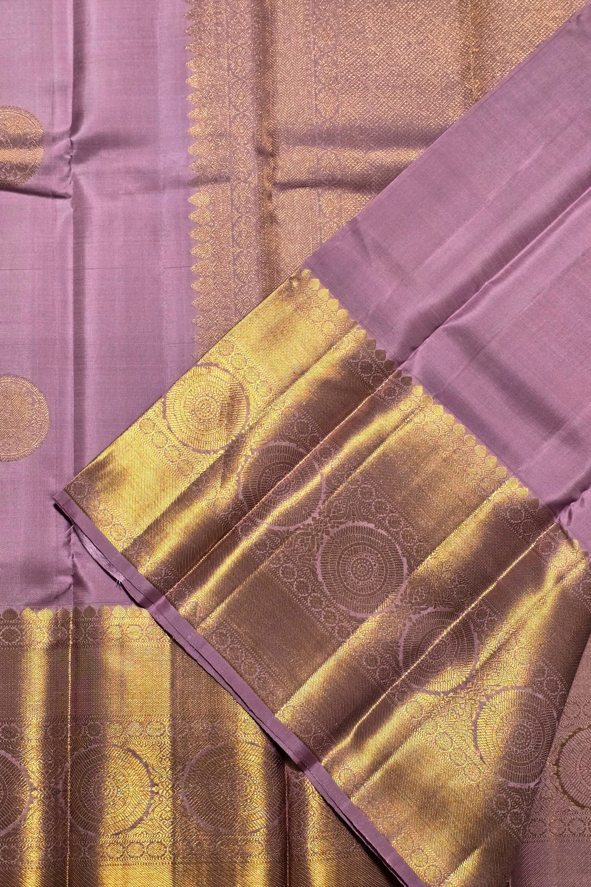 Purple fabric with gold patterns and border
