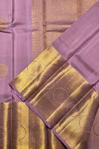 Purple fabric with gold patterns and border