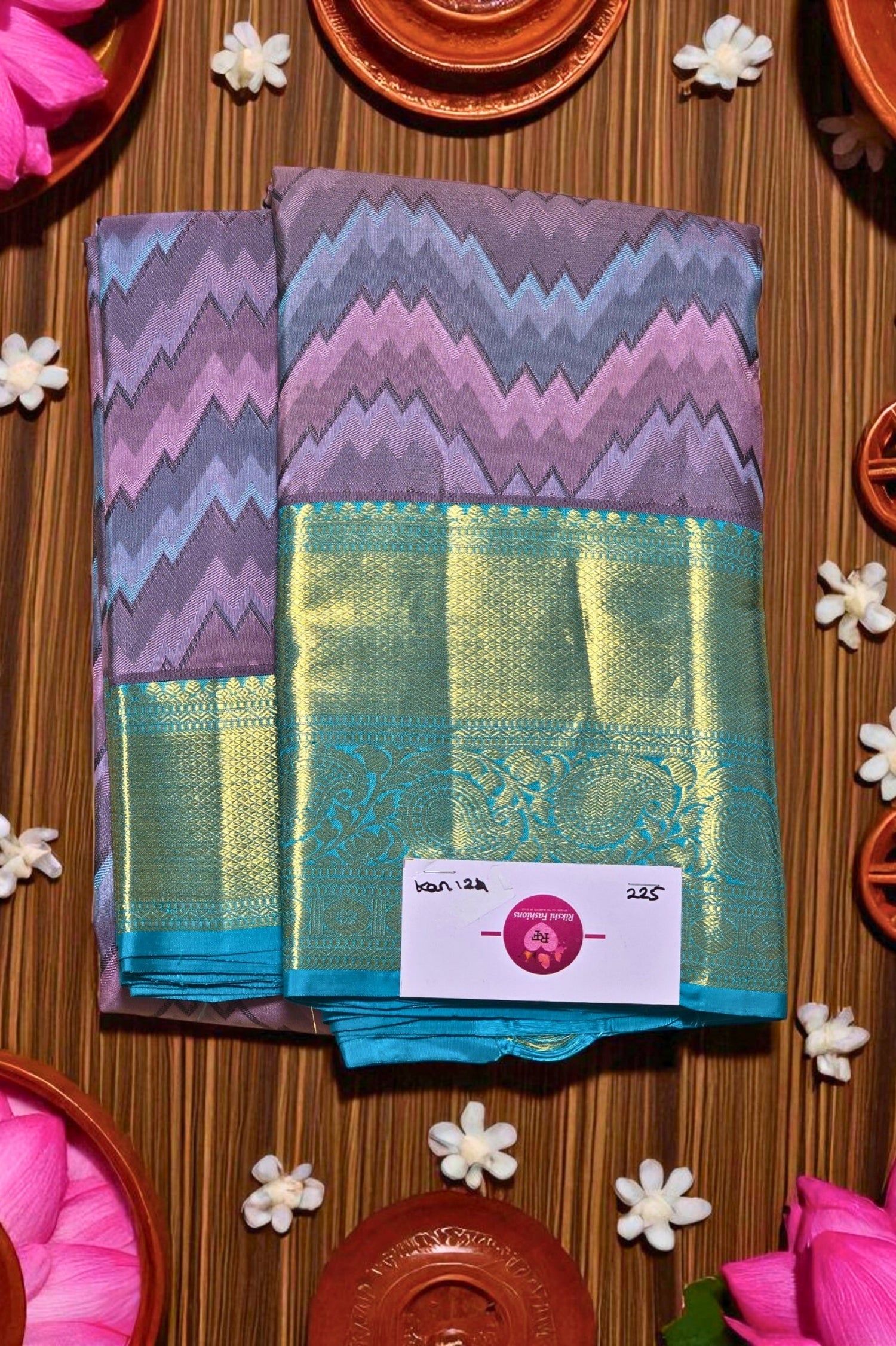 Colorful fabric with a zigzag pattern on a wooden surface with decorative elements.