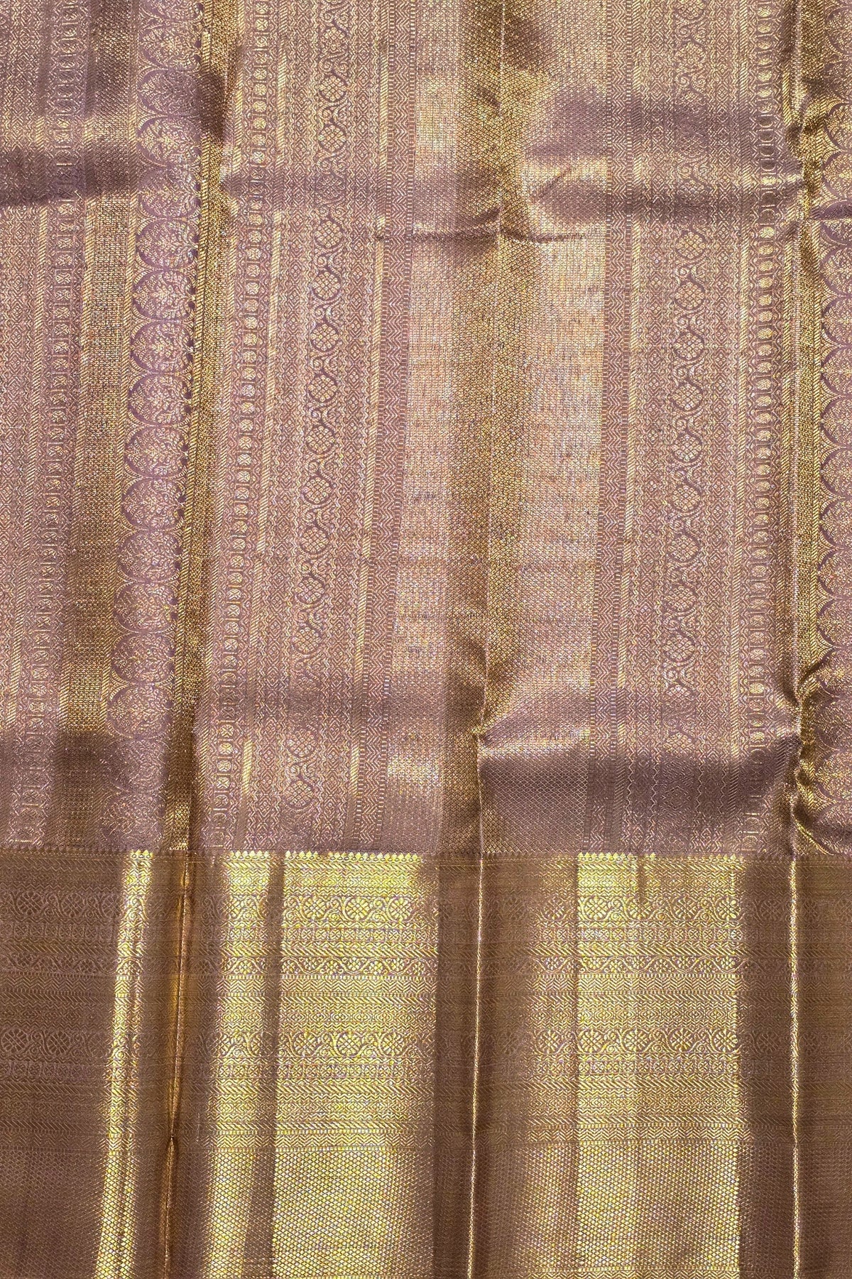 Close-up of patterned fabric with vertical stripes and textured design.