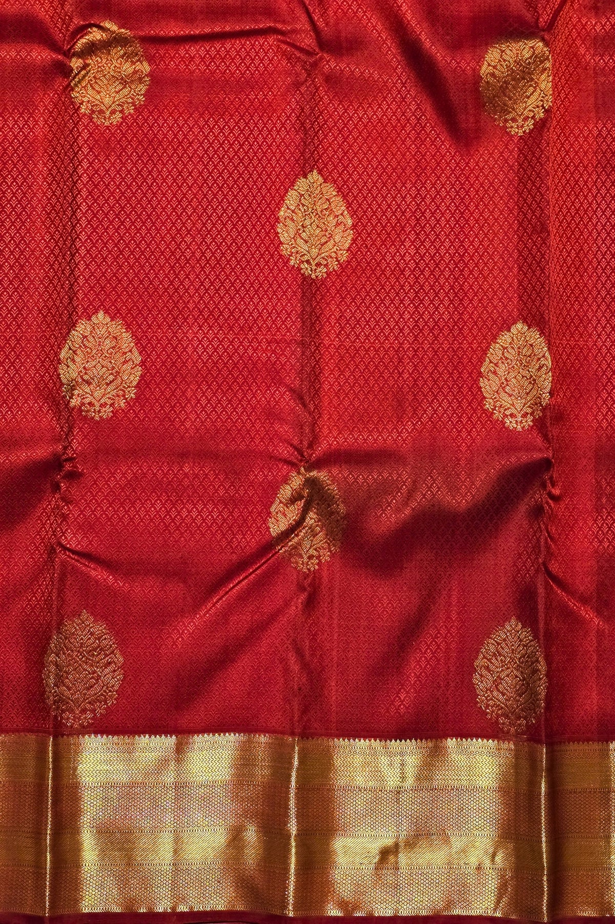 Red fabric with gold floral patterns