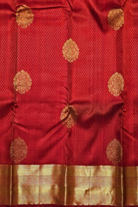 Red fabric with gold floral patterns