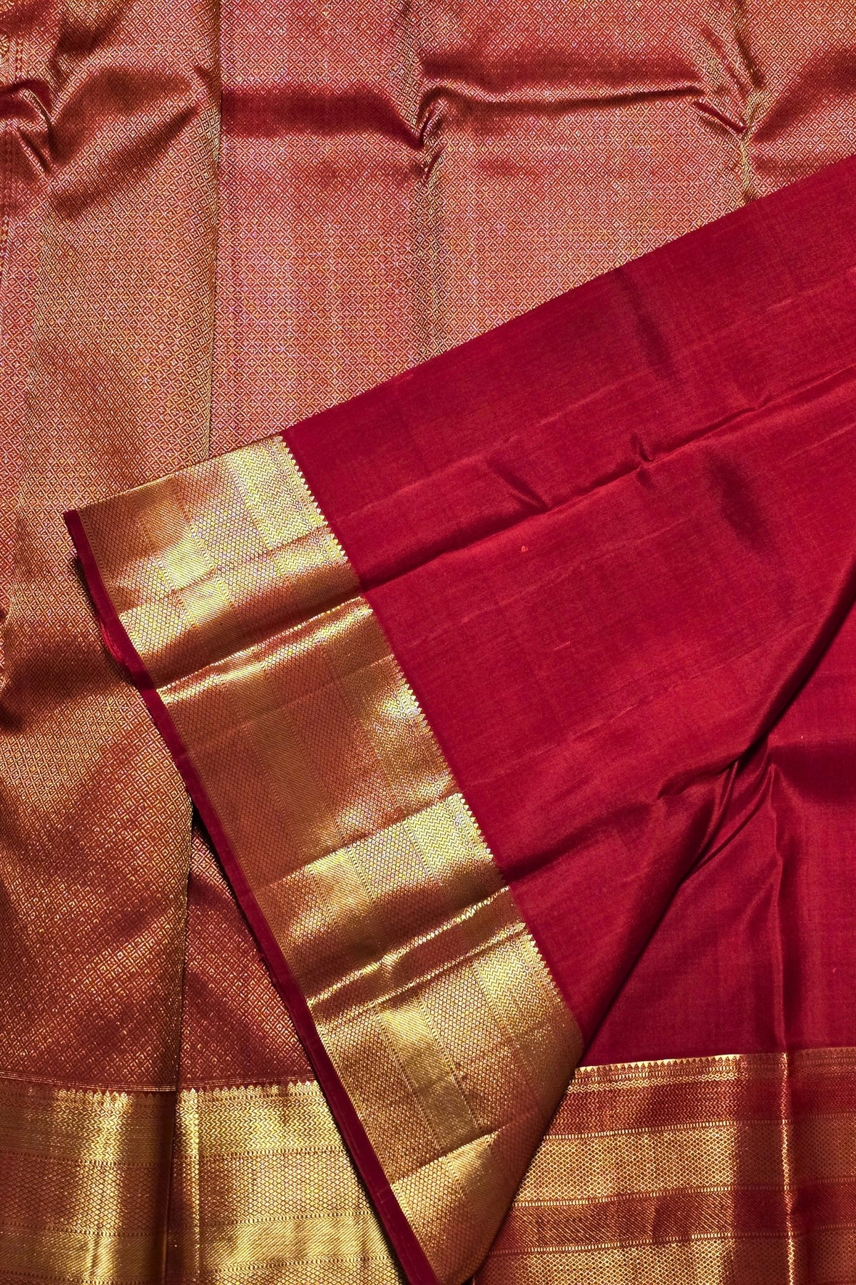 Red fabric with gold border and pattern