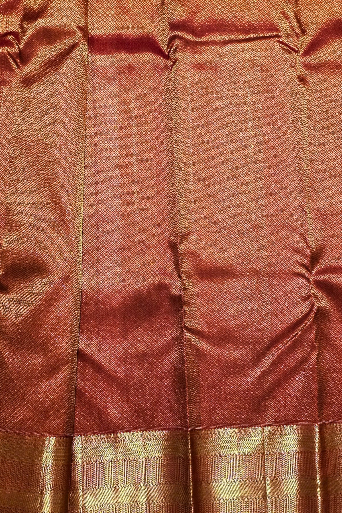 Close-up of brown fabric with a subtle pattern