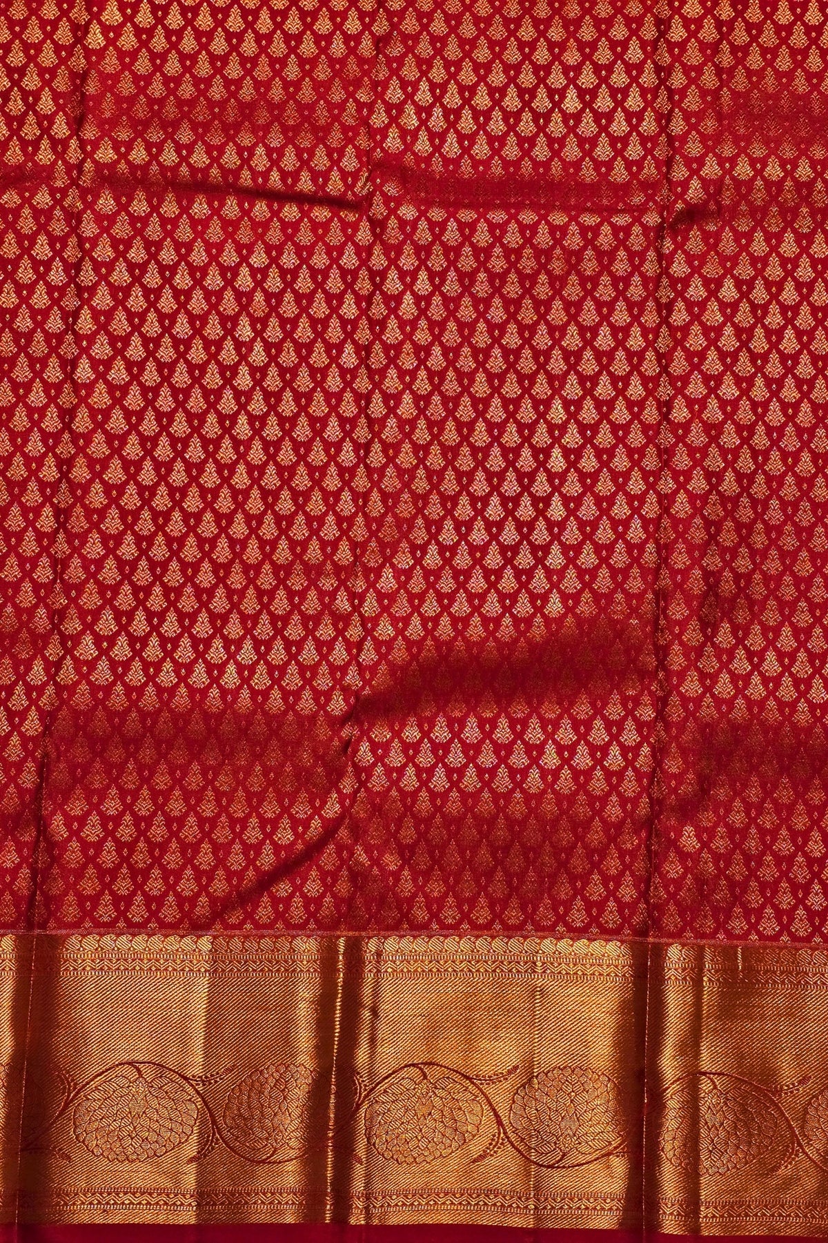 Red and gold patterned fabric with a subtle design