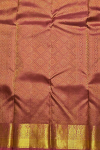 Brown fabric with gold border and intricate patterns