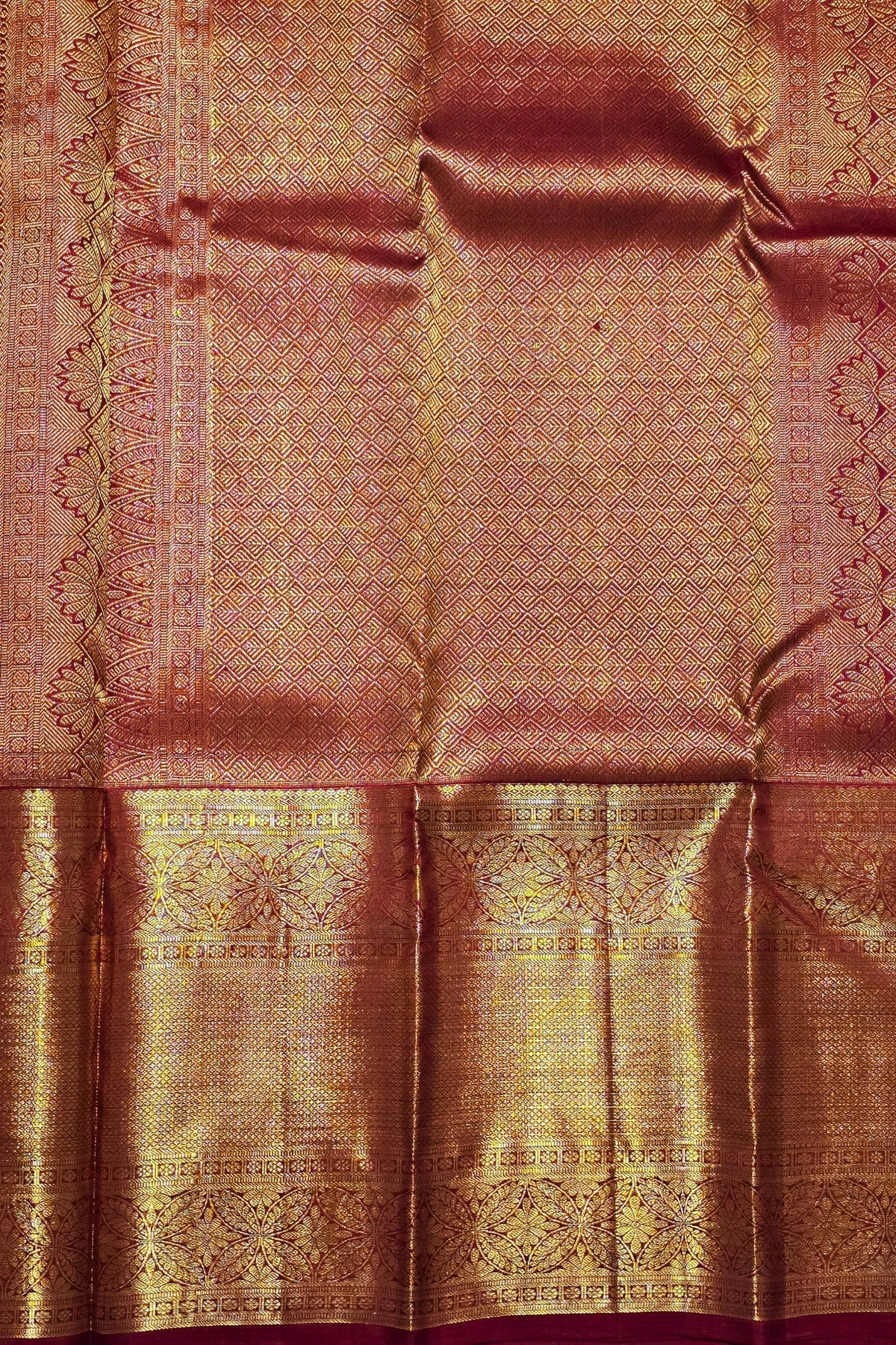Brown fabric with intricate gold patterns