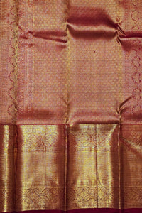 Brown fabric with intricate gold patterns