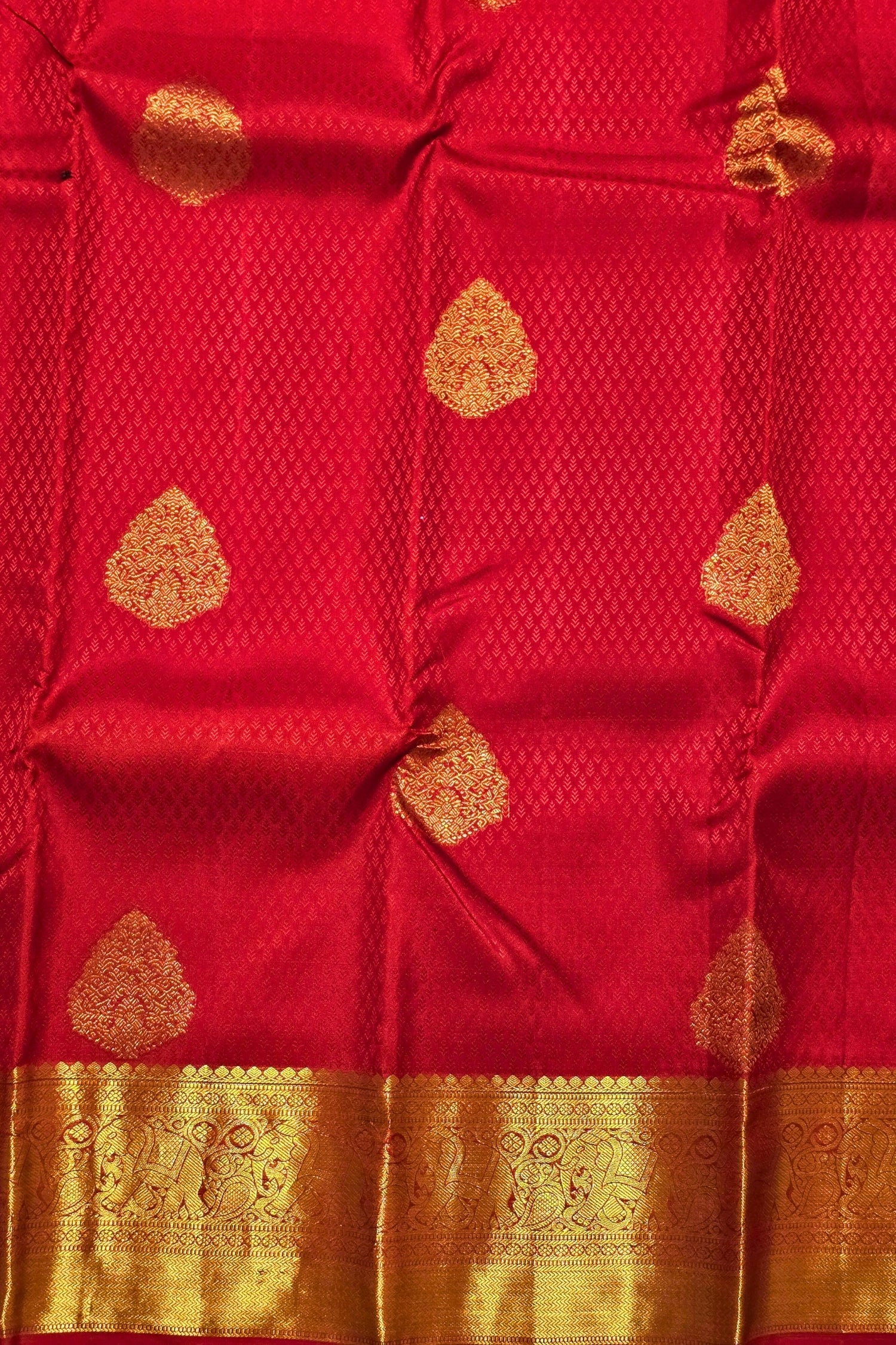 Red fabric with gold patterns