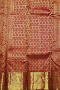 Red and gold traditional fabric with intricate patterns