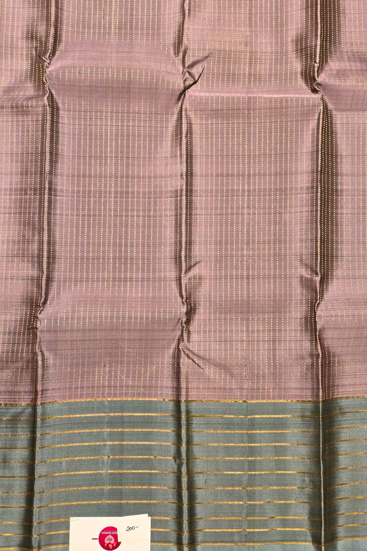 Fabric with a checkered pattern and a brand label in the corner